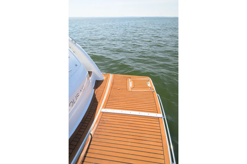 Slide: The Image of 2010 Formula 45 Yacht's teak swim platform on calm water. - 14