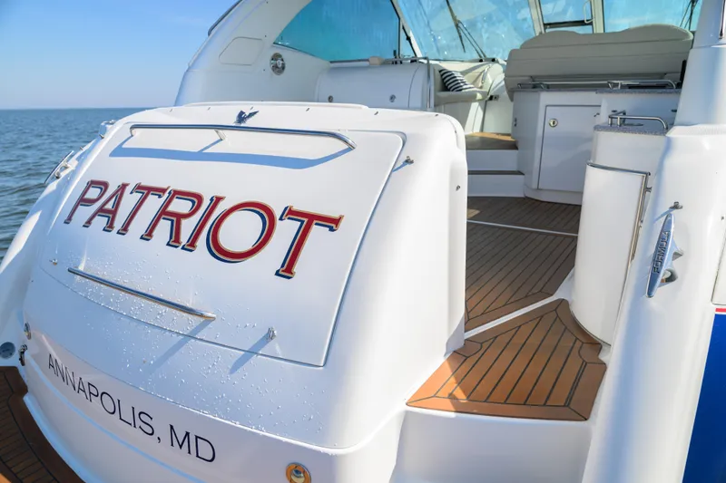 Slide: The Image of 2010 Formula 45 Yacht "Patriot" docked in Annapolis, MD, with teak deck and open cockpit. - 16