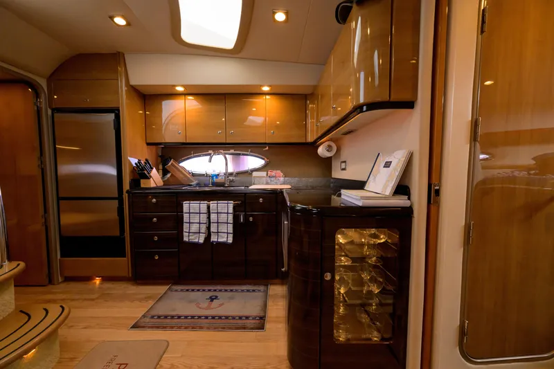 Slide: The Image of Luxurious kitchen interior of 2010 Formula 45 Yacht with wooden cabinetry and modern appliances. - 23