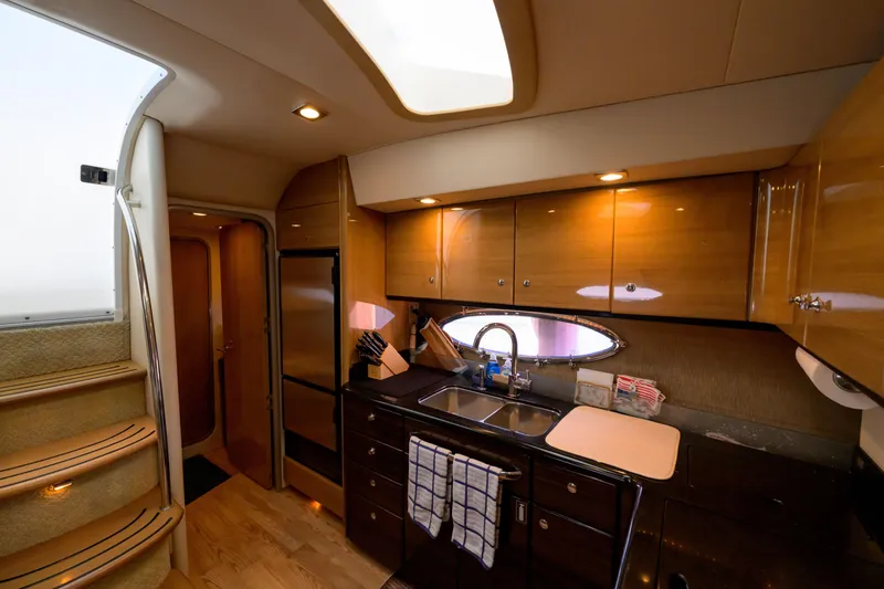 Slide: The Image of Luxurious interior of 2010 Formula 45 Yacht kitchen with wood cabinets and modern appliances. - 24