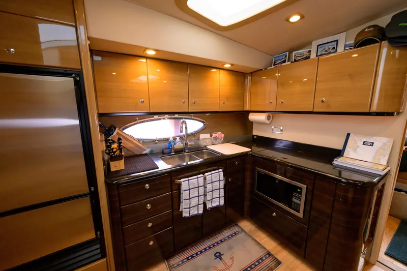 Slide: The Image of Luxurious kitchen interior of a 2010 Formula 45 Yacht with modern amenities. - 25