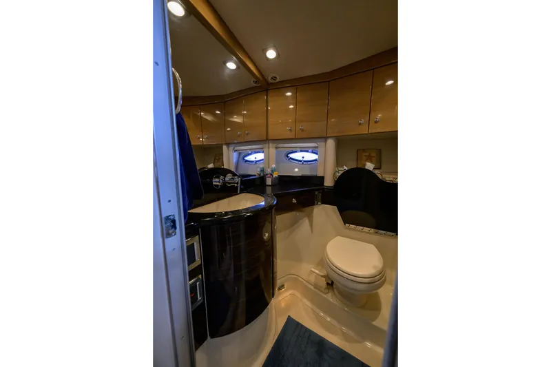 Slide: The Image of Luxurious bathroom interior of 2010 Formula 45 Yacht with modern fixtures and wood cabinetry. - 29