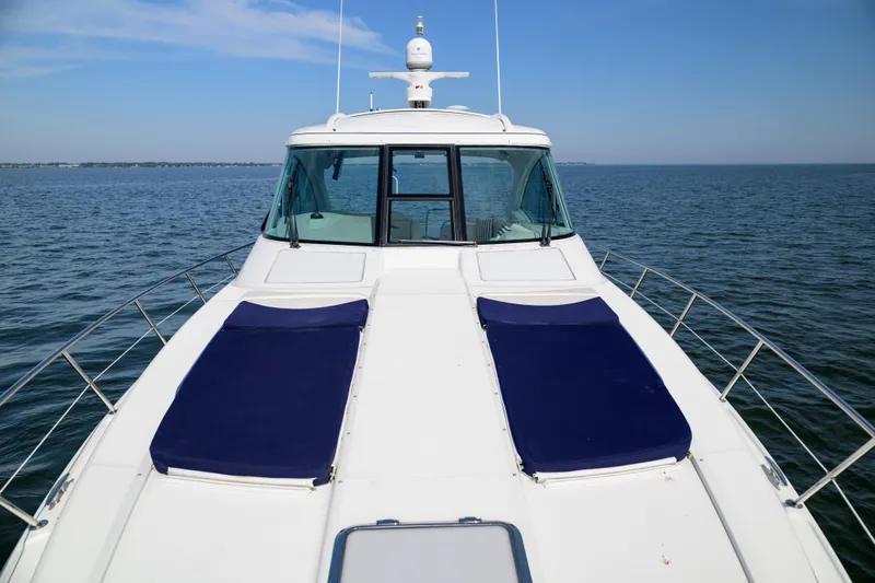 Slide: The Image of 2010 Formula 45 Yacht on open water, featuring sleek design and sunbathing pads. - 3