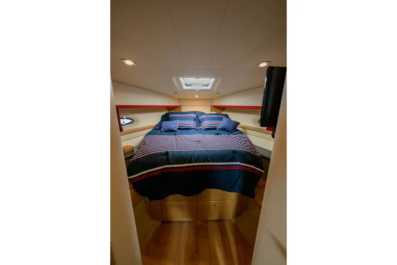 Slide: The Image of Luxurious bedroom interior of 2010 Formula 45 Yacht with striped bedding and modern lighting. - 33