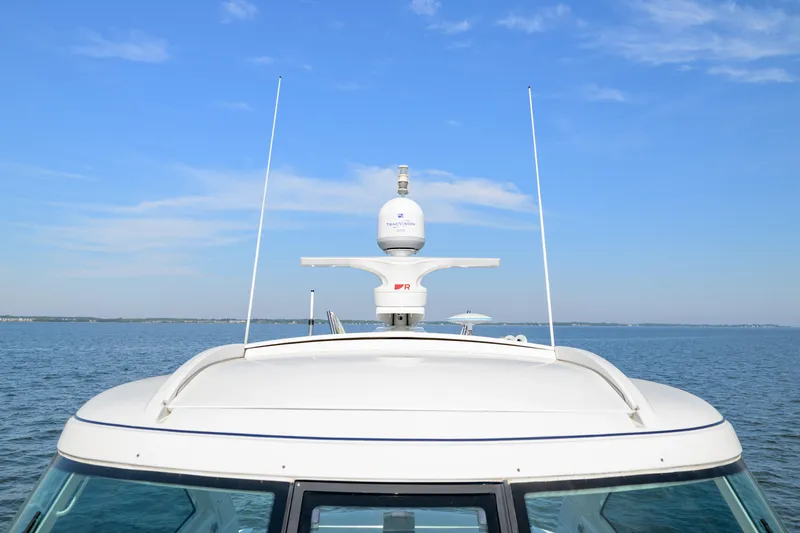 Slide: The Image of 2010 Formula 45 Yacht on calm water under clear blue sky. - 4