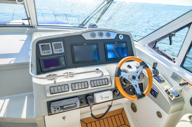 Slide: The Image of Helm of 2010 Formula 45 Yacht with modern navigation equipment and ocean view. - 6