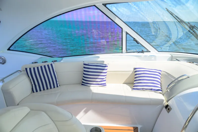 Slide: The Image of Luxurious interior of 2010 Formula 45 Yacht with striped cushions and ocean view. - 8