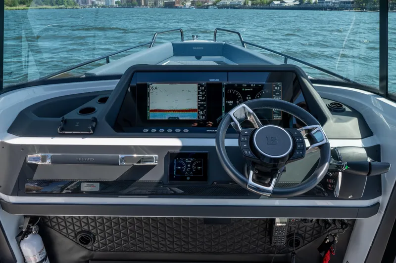 Slide: The Image of 2024 BRABUS Shadow 500 Cabin Wet Bar dashboard with advanced navigation system on open water. - 15