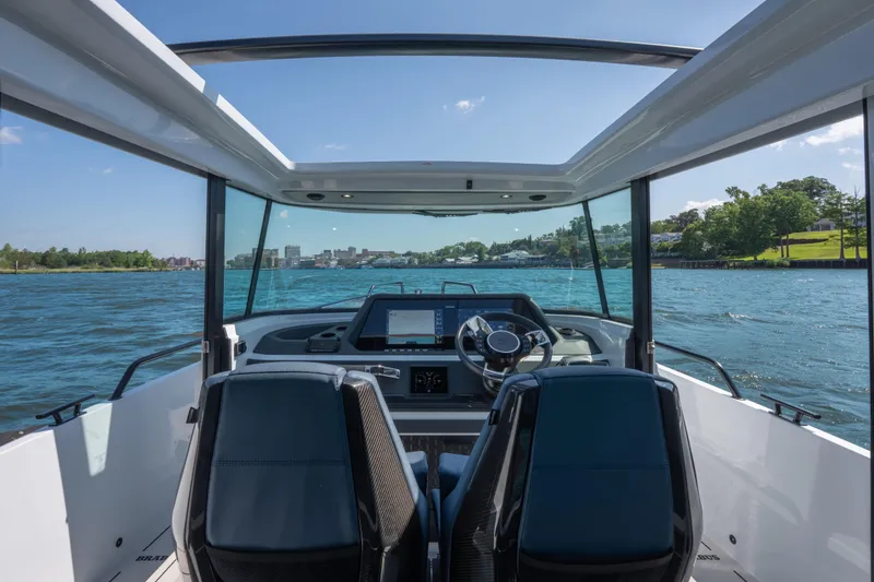 Slide: The Image of 2024 BRABUS Shadow 500 Cabin Wet Bar interior with scenic water view. - 13