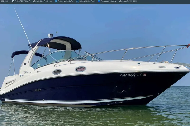 The Image of 2006 Sea Ray Sundancer 260 boat on water, featuring sleek design and blue hull. - 0