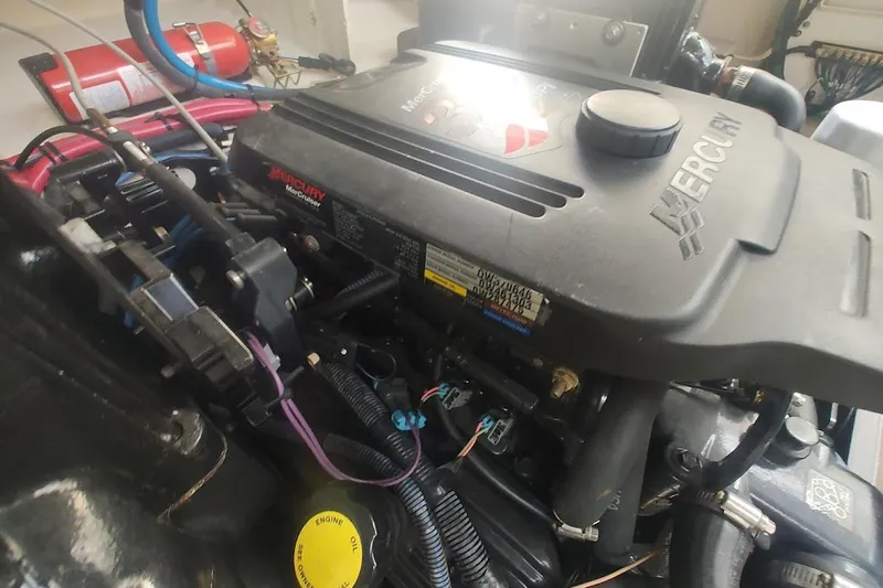 Slide: The Image of Engine compartment of a 2006 Sea Ray Sundancer 260 with Mercury MerCruiser components. - 22