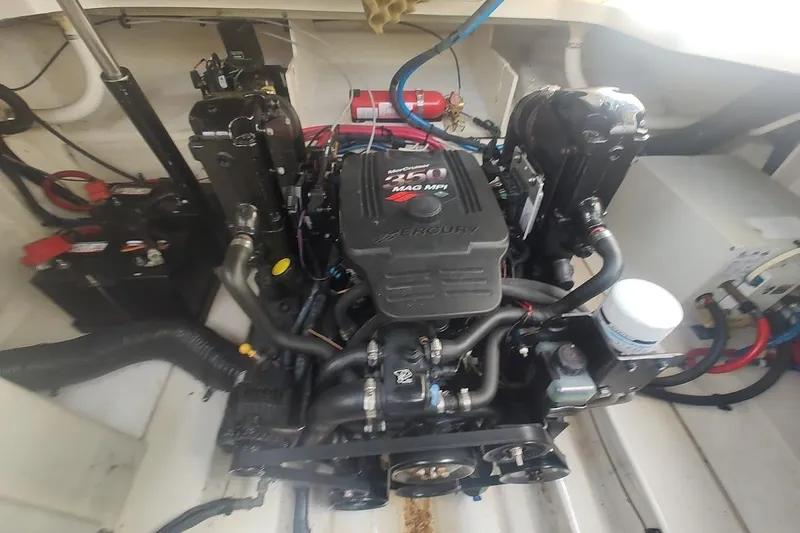 Slide: The Image of Engine compartment of a 2006 Sea Ray Sundancer 260 boat, featuring a Mercury 350 MAG MPI engine. - 23