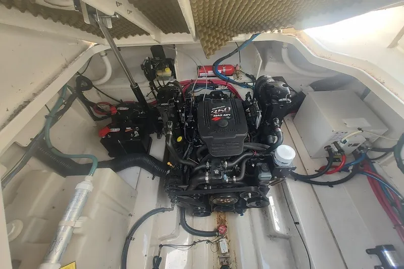 Slide: The Image of Engine compartment of a 2006 Sea Ray Sundancer 260 boat, featuring a MerCruiser 250 MAG MPI engine. - 24