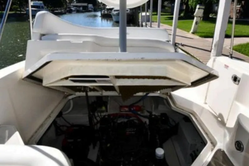 Slide: The Image of Open engine compartment of a 2006 Sea Ray Sundancer 260 boat by a canal. - 6