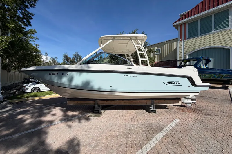 The Image of 2016 Boston Whaler 230 Vantage boat displayed outdoors on a sunny day. - 0
