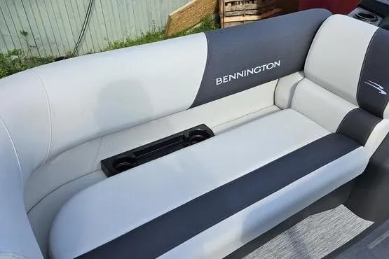 Slide: The Image of 2026 Bennington 22 SSR boat seat with sleek gray upholstery and integrated cup holders. - 10