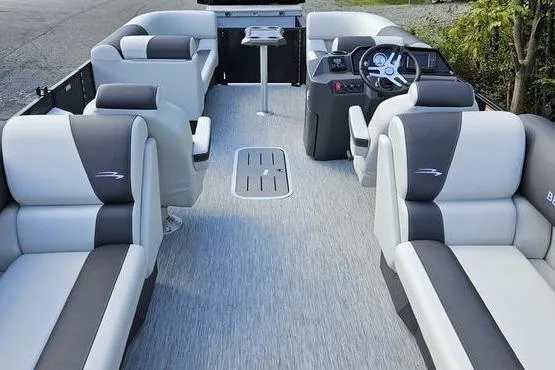 Slide: The Image of 2026 Bennington 22 SSR pontoon boat interior with plush seating and modern helm. - 12