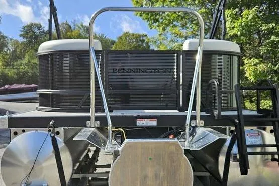 Slide: The Image of 2026 Bennington 22 SSR pontoon boat rear view with ladder and sleek design. - 3
