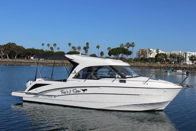 Slide: The Image of 2021 Beneteau Antares 8 boat on calm water, with scenic background. - 5