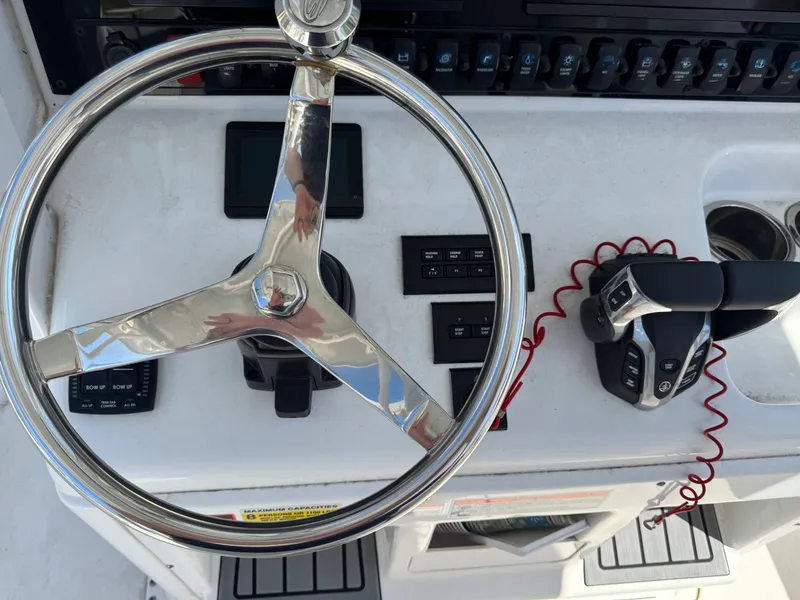 Slide: The Image of Steering console of Sea Hunt Gamefish 25 boat, year 2024. - 11