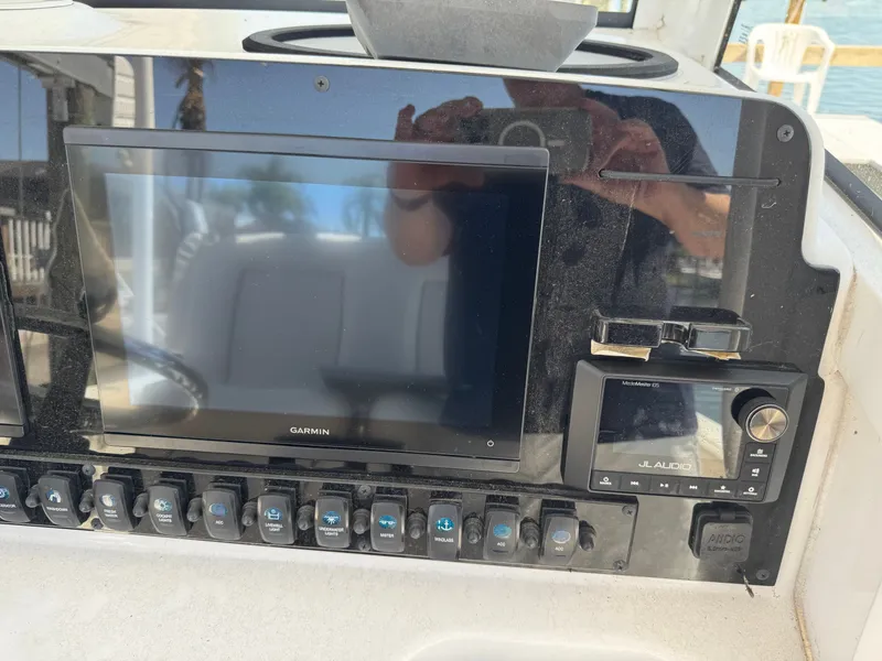 Slide: The Image of 2024 Sea Hunt Gamefish 25 boat console with Garmin and JL Audio system. - 15