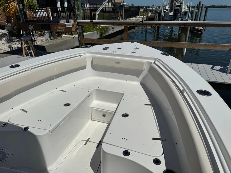 Slide: The Image of 2024 Sea Hunt Gamefish 25 boat docked with spacious deck. - 16