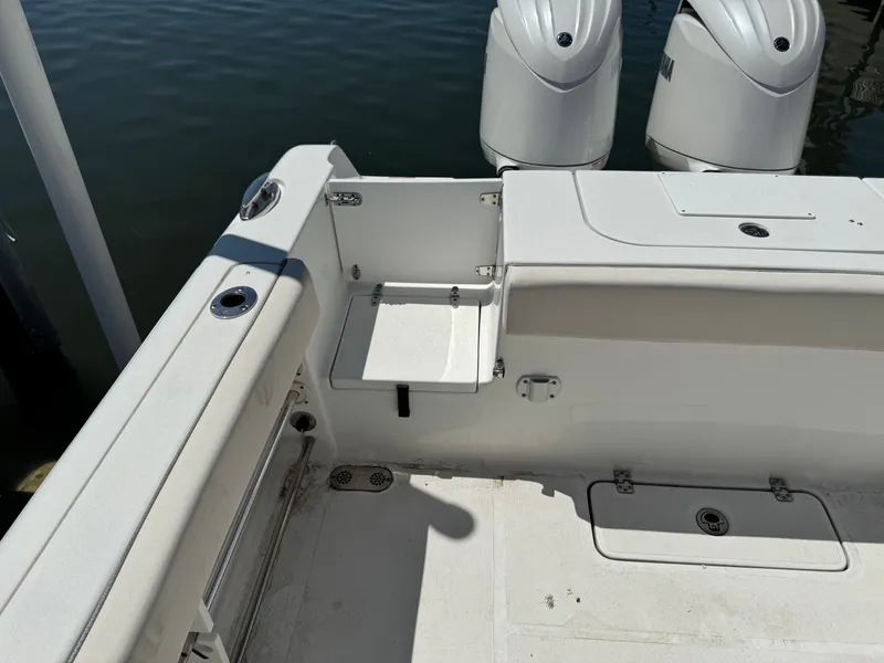 Slide: The Image of 2024 Sea Hunt Gamefish 25 boat with engine view. - 23