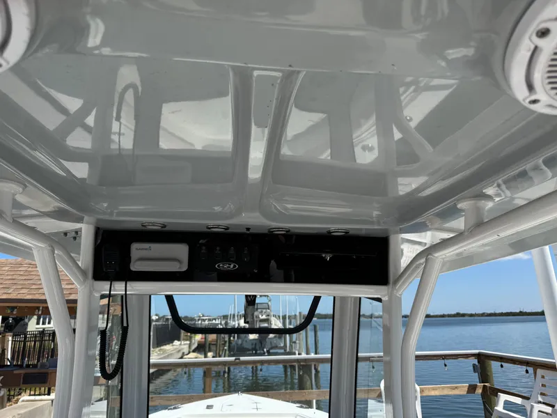 Slide: The Image of Interior view of a 2024 Sea Hunt Gamefish 25 boat with electronics. - 26