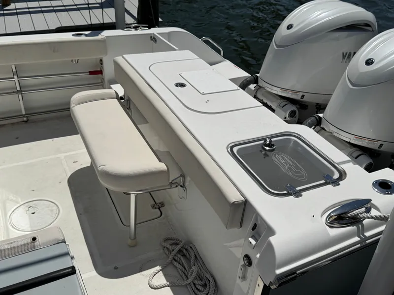 Slide: The Image of 2024 Sea Hunt Gamefish 25 with dual engines and seating bench. - 38