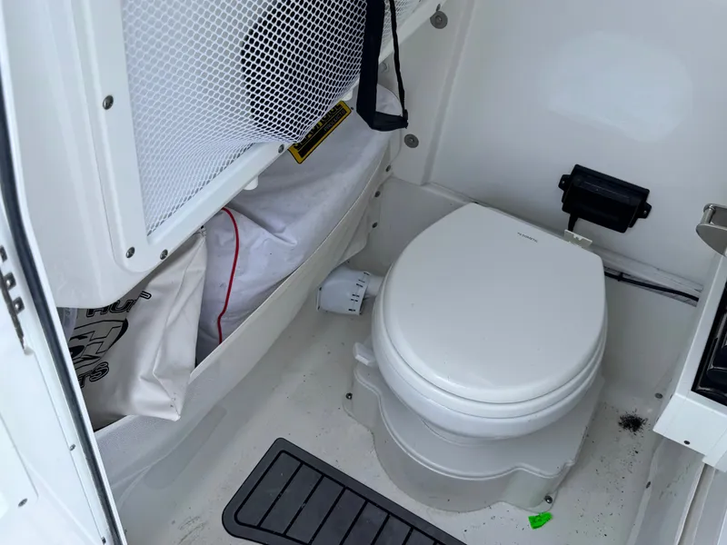 Slide: The Image of Interior of 2024 Sea Hunt Gamefish 25 with toilet. - 40
