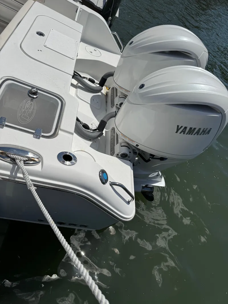 Slide: The Image of 2024 Sea Hunt Gamefish 25 with Yamaha engines at dock. - 46