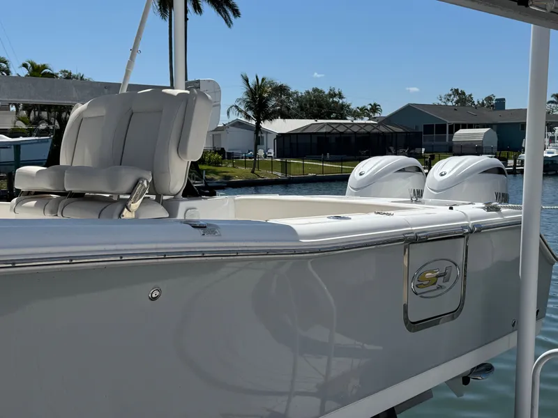 Slide: The Image of 2024 Sea Hunt Gamefish 25 boat with twin engines at the dock. - 6