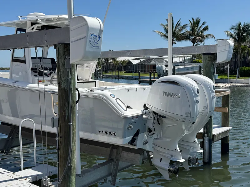 Slide: The Image of 2024 Sea Hunt Gamefish 25 boat with Yamaha engines at dock. - 7
