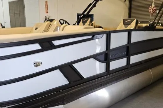 Slide: The Image of 2026 Evotti 521QL pontoon boat with sleek design in a showroom setting. - 3