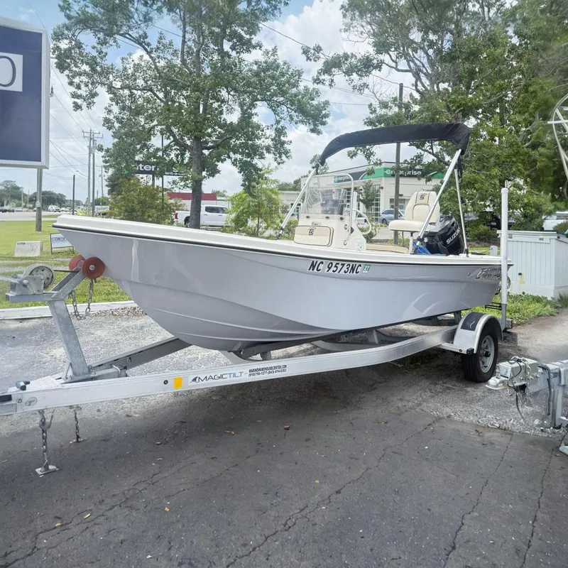 The Image of 2023 Carolina Skiff 162 JLS boat on trailer, parked outdoors. - 0