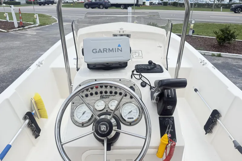 Slide: The Image of 2023 Carolina Skiff 162 JLS boat dashboard with Garmin navigation system. - 4