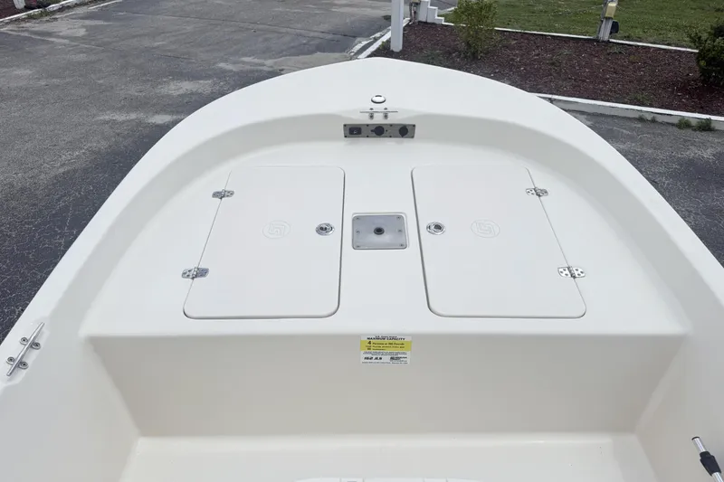 Slide: The Image of 2023 Carolina Skiff 162 JLS boat deck with storage compartments and clean design. - 5
