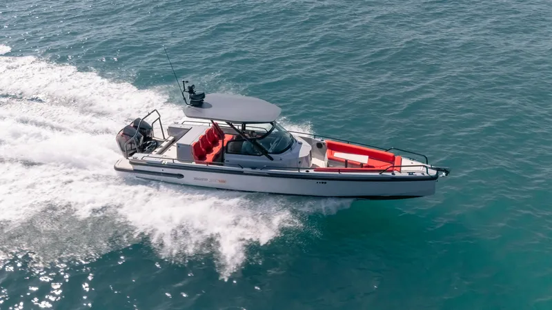 Slide: The Image of 2023 BRABUS Shadow 500 T-Top boat cruising on open water. - 1
