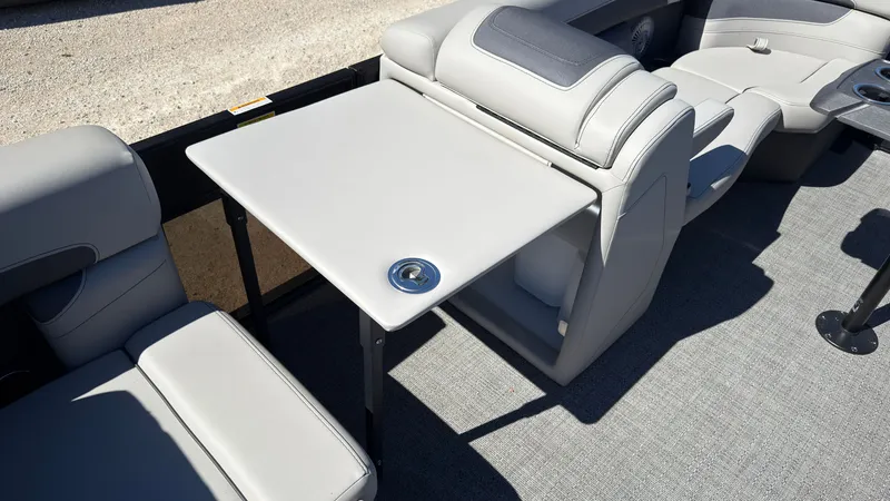 Slide: The Image of Interior of 2025 Barletta C22U with gray seating and table. - 13