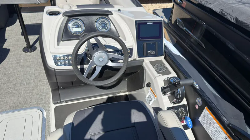 Slide: The Image of Interior view of 2025 Barletta C22U helm with steering wheel and instruments. - 19