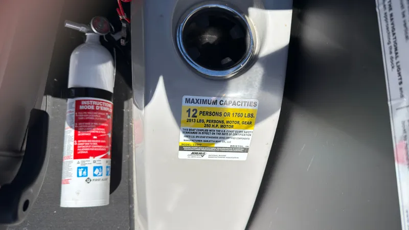 Slide: The Image of Barletta C22U 2025 boat capacity label and fire extinguisher. - 25