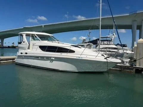 The Image of 2005 Sea Ray 390 Motor Yacht docked under bridge. - 0
