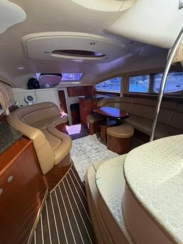Slide: The Image of Interior of 2005 Sea Ray 390 Motor Yacht, luxurious design with wood accents. - 10