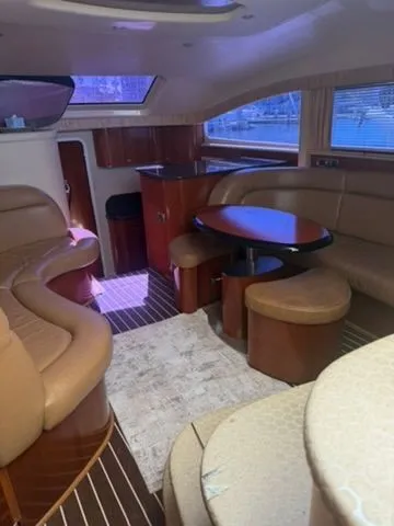 Slide: The Image of Interior of a 2005 Sea Ray 390 Motor Yacht with elegant leather seating. - 11