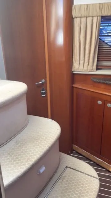 Slide: The Image of Interior of 2005 Sea Ray 390 Motor Yacht with stairs and wooden cabinetry. - 12
