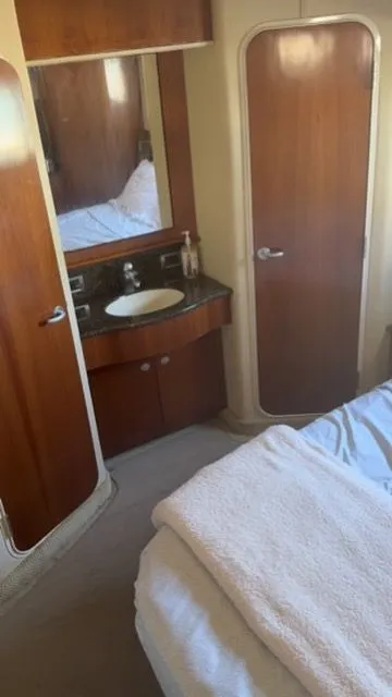 Slide: The Image of Interior of 2005 Sea Ray 390 Motor Yacht with sink and bed. - 19