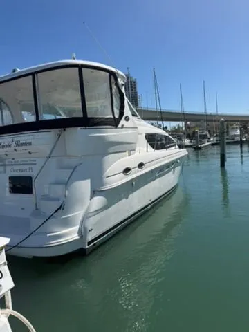 Slide: The Image of 2005 Sea Ray 390 Motor Yacht docked in marina. - 2