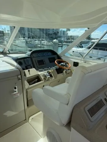 Slide: The Image of Interior of 2005 Sea Ray 390 Motor Yacht, helm station with marina view. - 6