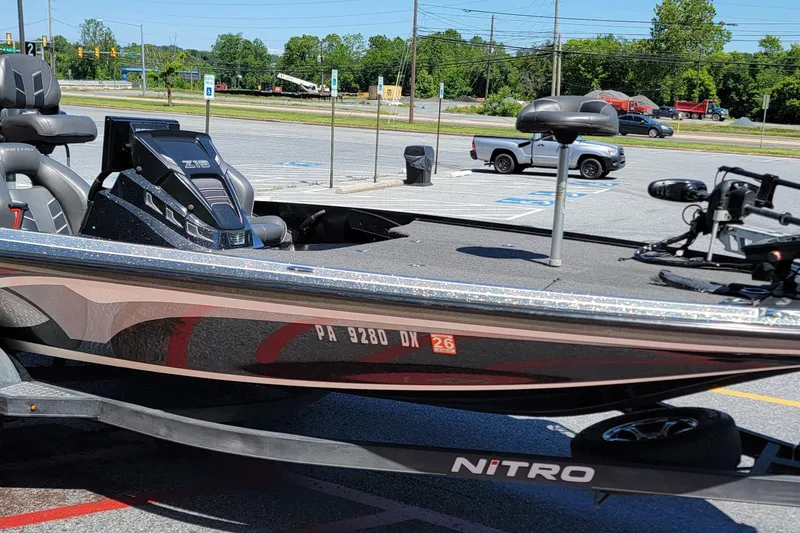 Slide: The Image of 2020 Nitro Z19 Pro boat in parking lot, showcasing sleek design and modern features. - 11