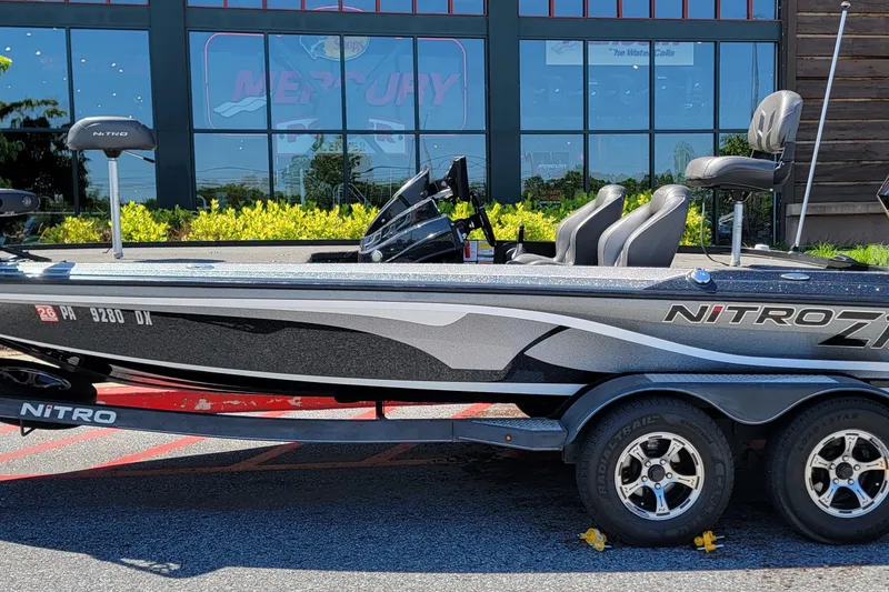 Slide: The Image of 2020 Nitro Z19 Pro boat on trailer, parked outside a building. - 2